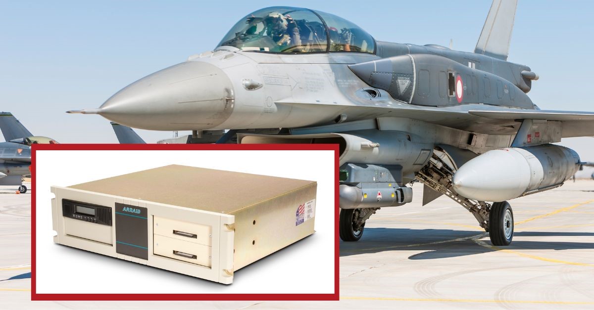 A military jet with a box Description automatically generated